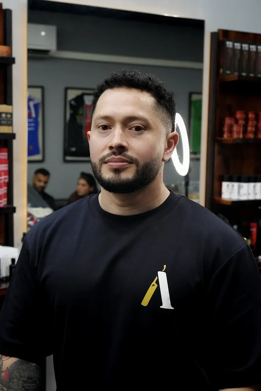 Juan, barber at Atta Barbershop